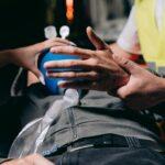 a paramedic using a ambu bag to a patient