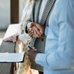a broker and a client doing a handshake