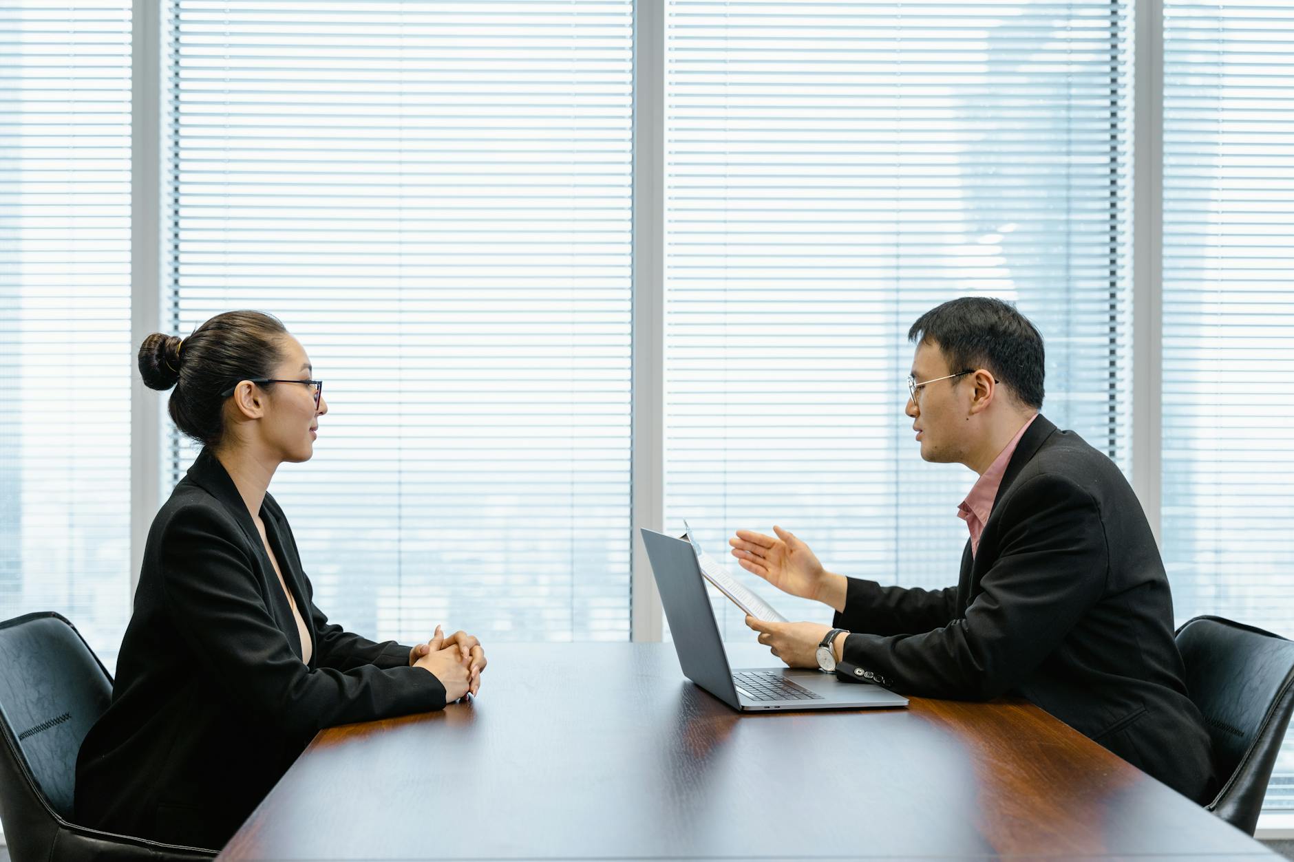 man interviewing a woman