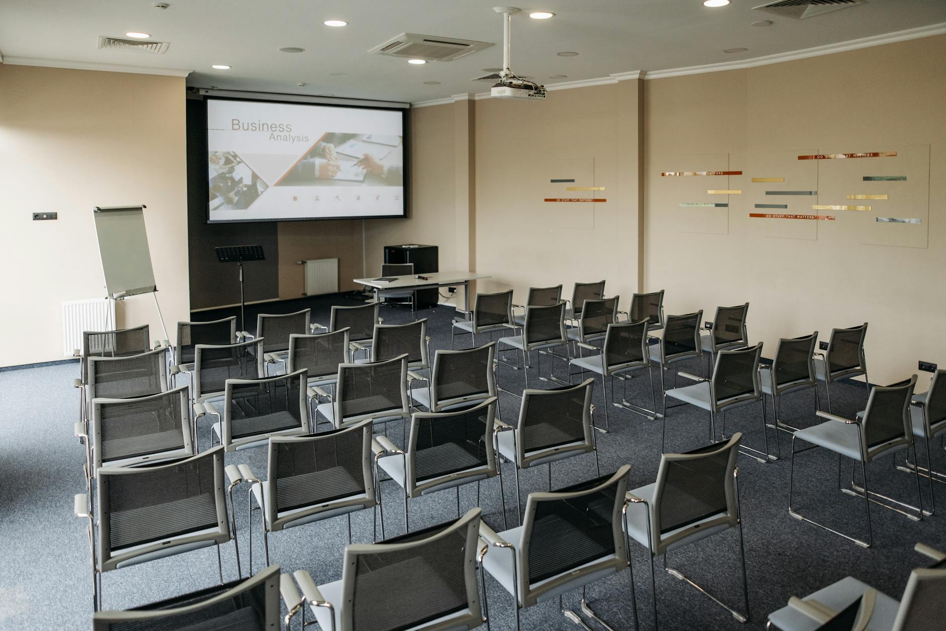 a room with seats and an image on the screen projector